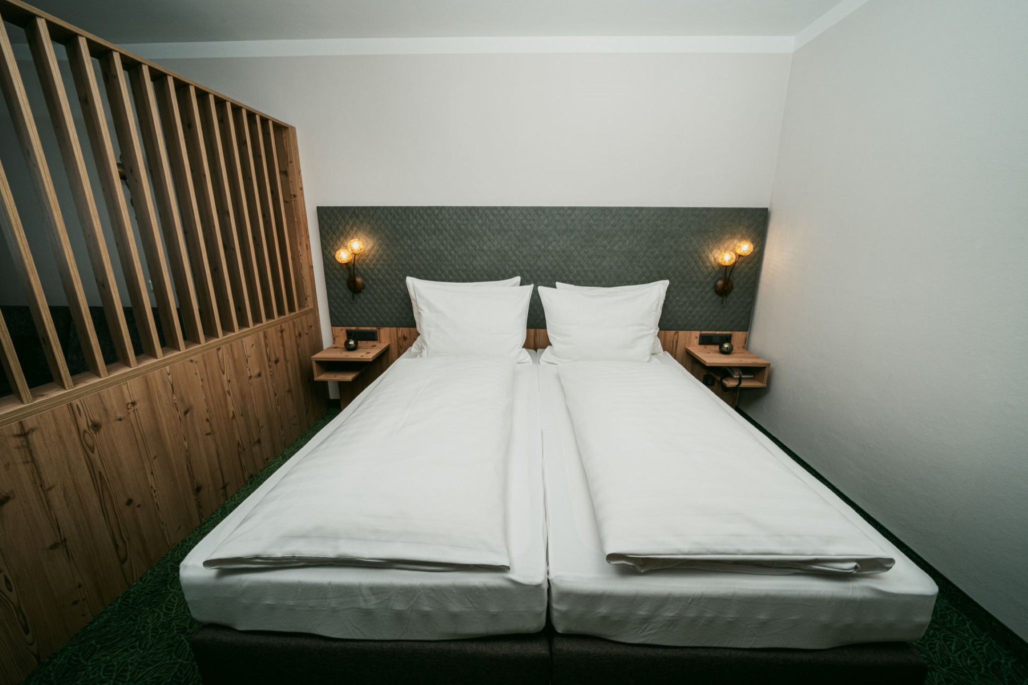 Doppelbett im Komfortzimmer Superior im Apparthotel Samson in Obertauern